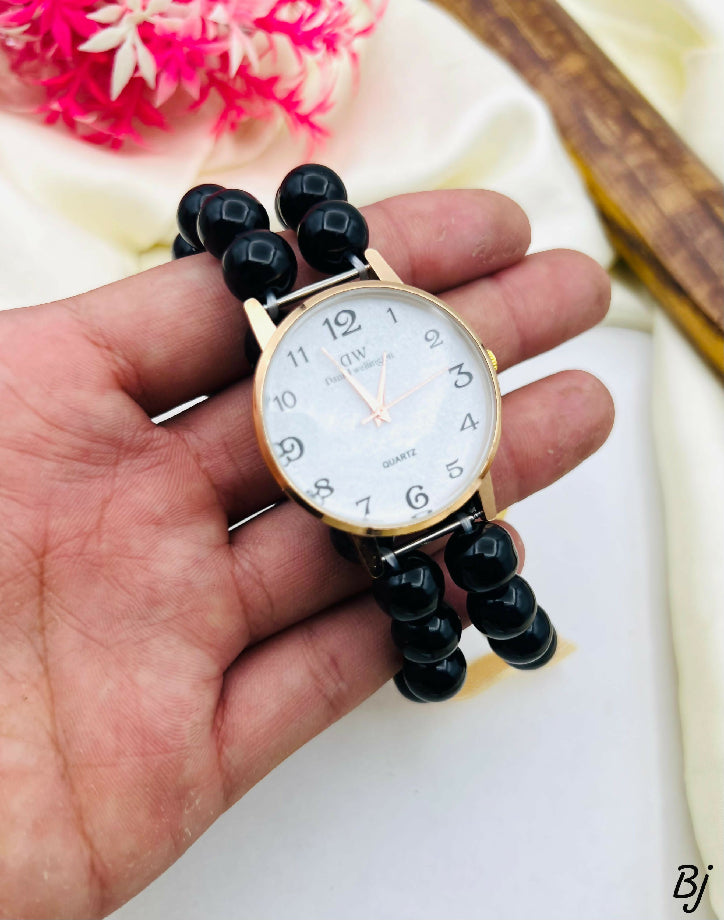 Elegant Black Bead Watch with Gold Accents