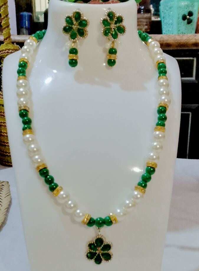 Handmade pearl and green moti nacklace set with stunning charms