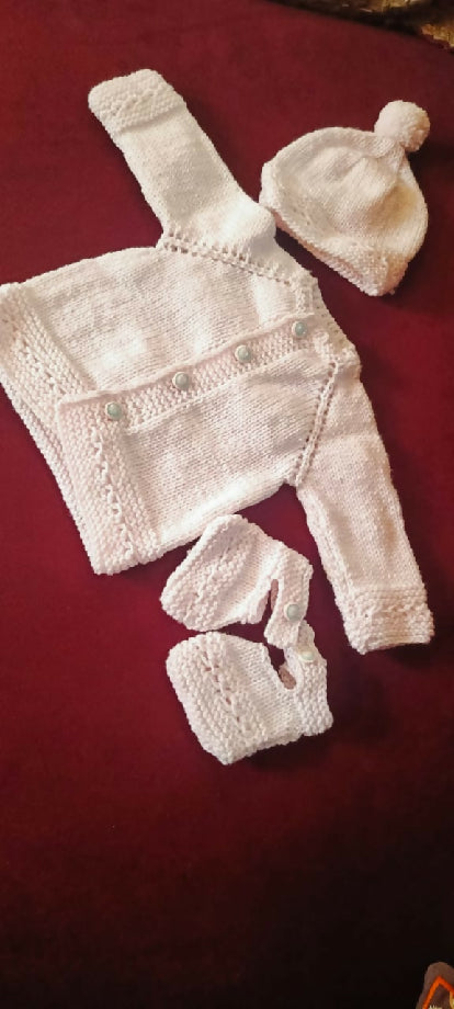 Adorable 3-Month-Old Baby Girl in a Soft Pink Knit Outfit