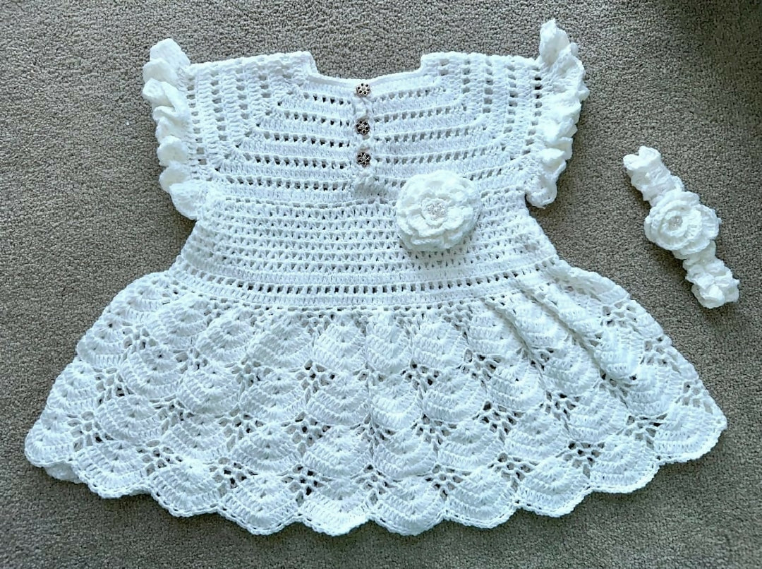Charming Baby in a Handcrafted Crochet Dress