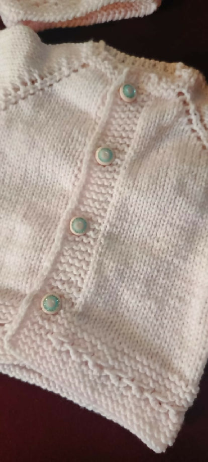 Adorable 3-Month-Old Baby Girl in a Soft Pink Knit Outfit