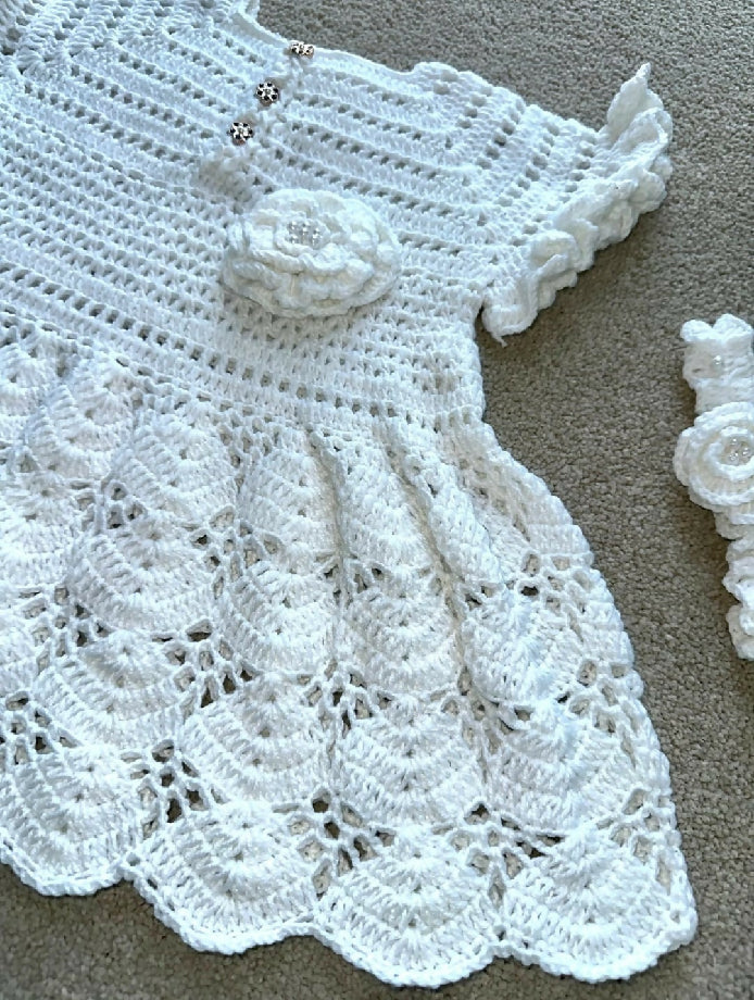 Charming Baby in a Handcrafted Crochet Dress